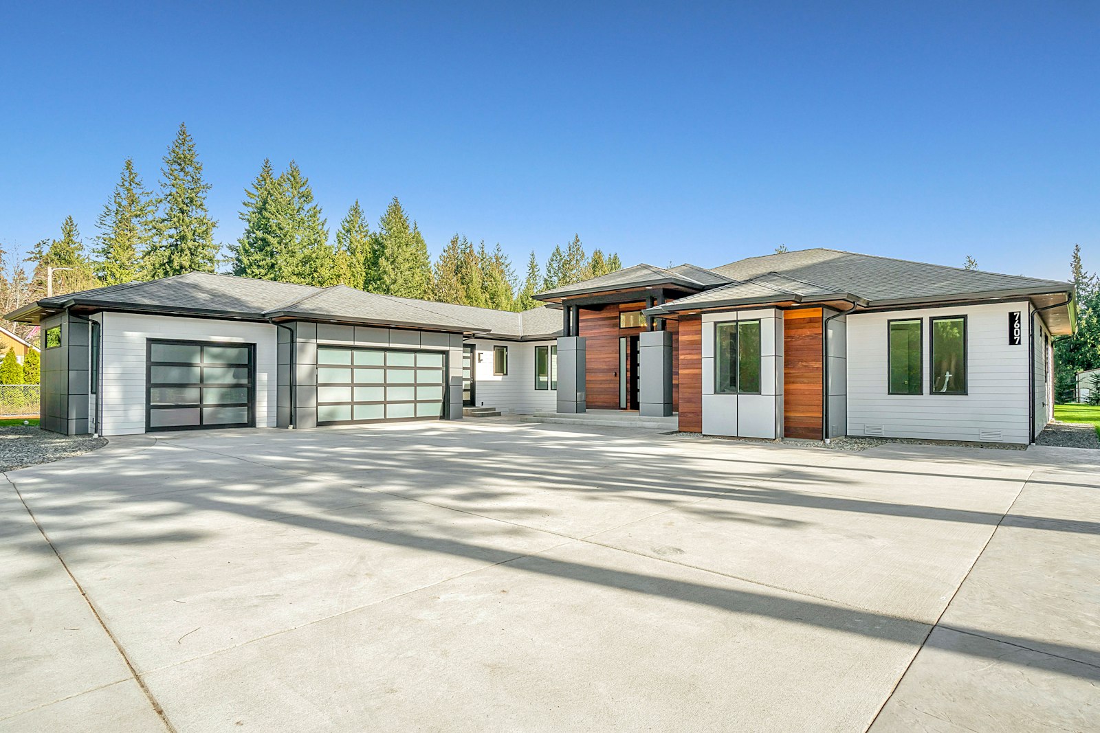 White and brown wooden house under blue sky